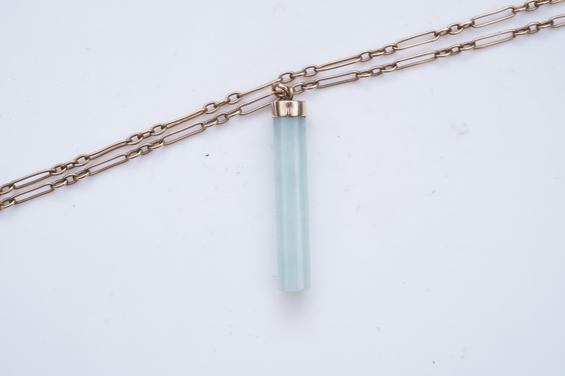 A jadeite pendant and pair of earrings